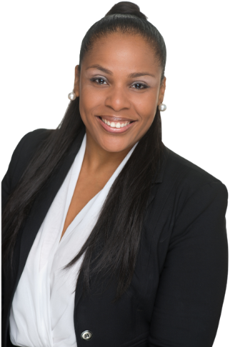 Valerie Jose, real estate broker, in a studio portrait wearing a dark blazer